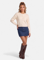Women's beige cropped button-down cardigan full body shot
