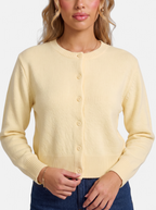 Women's yellow cropped button-down cardigan detail shot