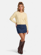 Women's yellow cropped button-down cardigan full body shot