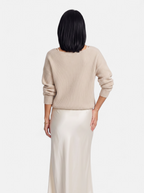 Women's cream satin skirt and sweater set back shot