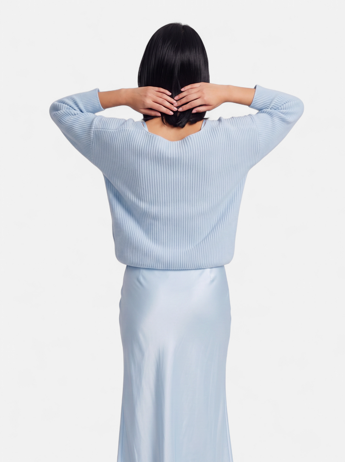 Women's light blue satin skirt and sweater set back shot