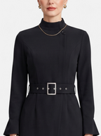 Women's black turtleneck belted a-line dress detail shot