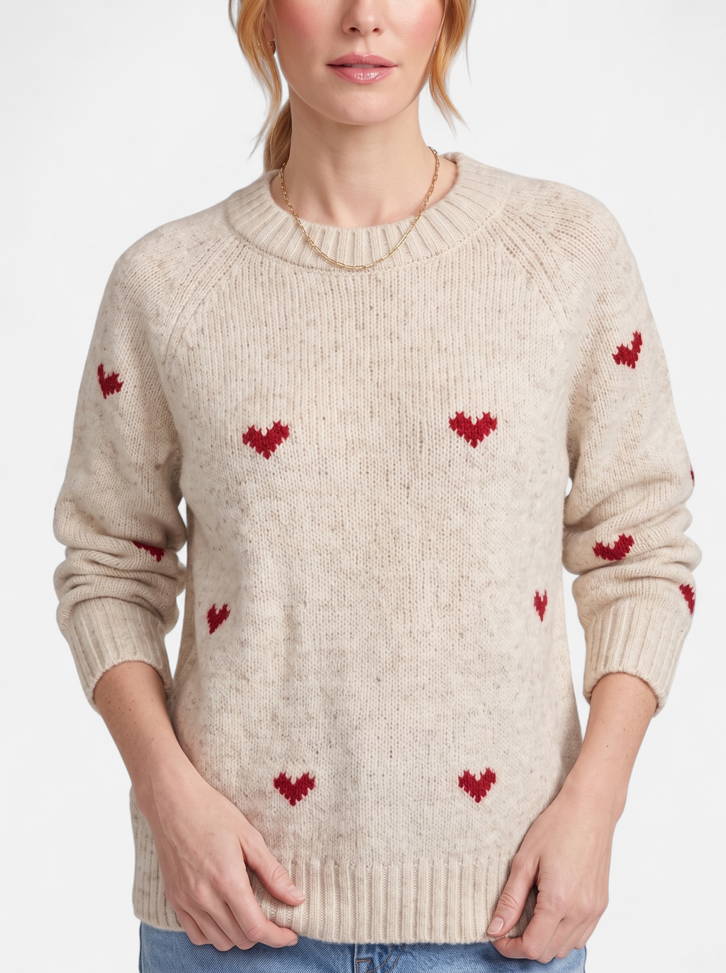 Women's apricot heart print crew neck sweater detail shot