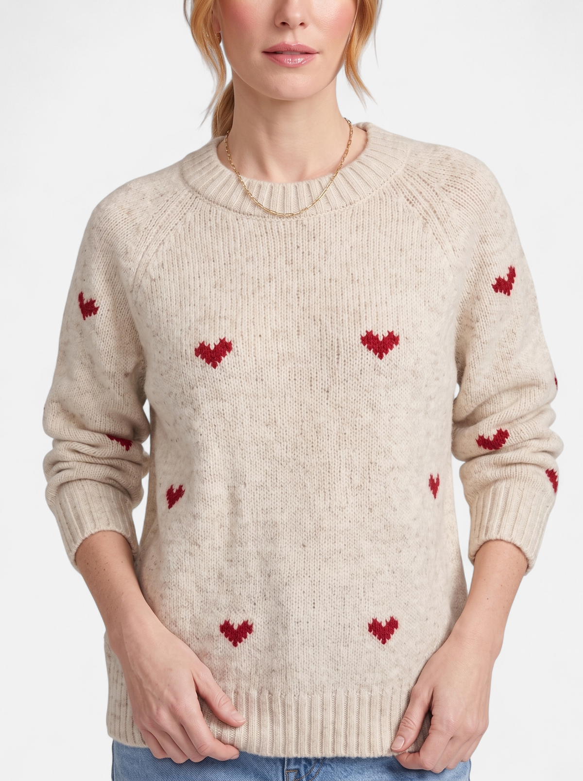 Women's apricot heart print crew neck sweater detail shot