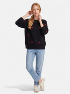 Women's black heart print crew neck sweater full body shot