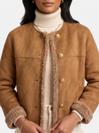 Women's beige faux fur motorcycle jacket detail shot