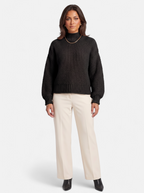 Women's black oversized turtleneck sweater full body shot