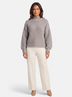 Women's gray oversized turtleneck sweater full body shot