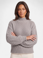 Women's gray oversized turtleneck sweater hero shot