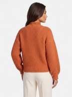 Women's orange oversized turtleneck sweater back shot