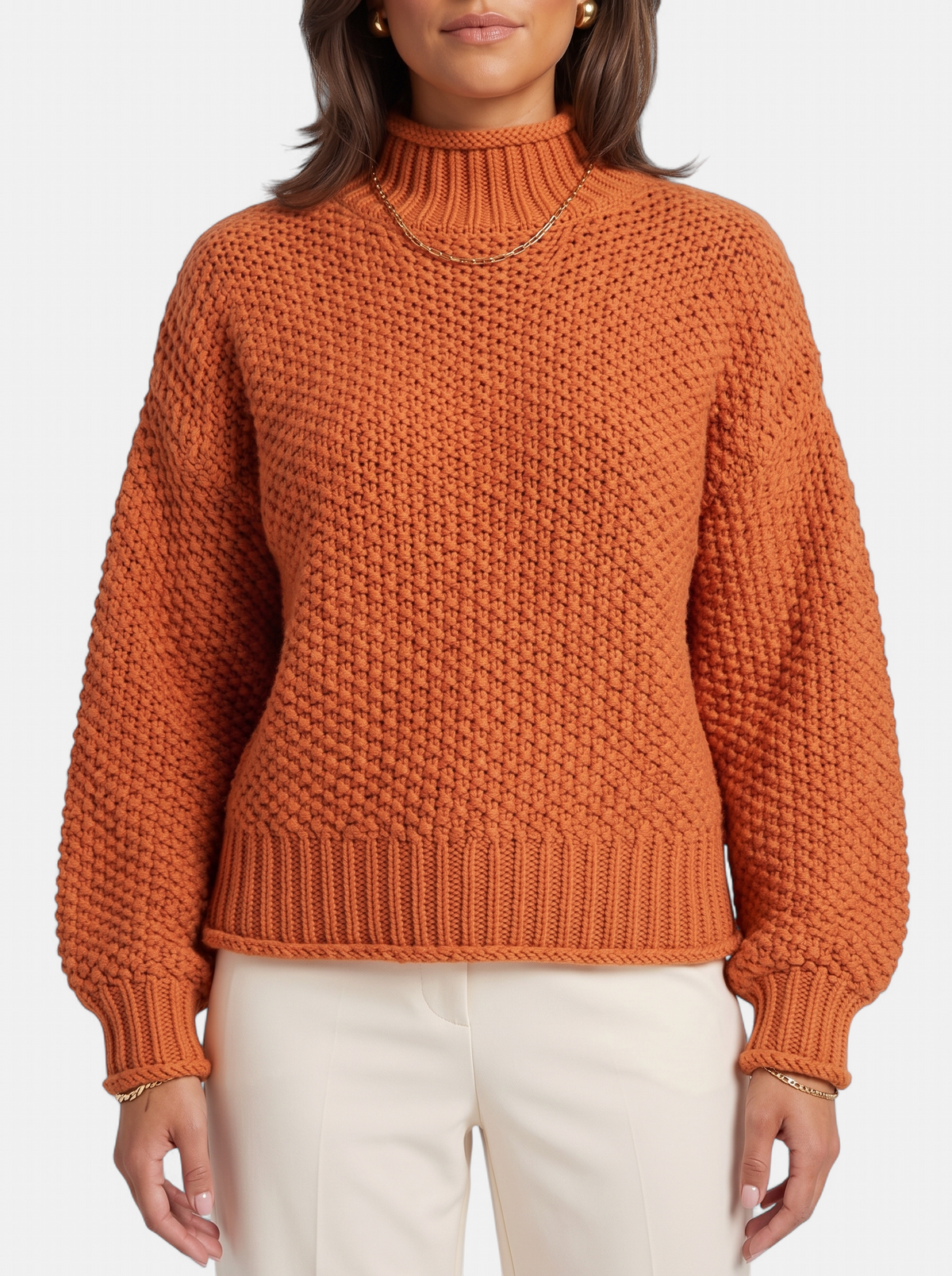 Women's orange oversized turtleneck sweater detail shot