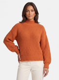 Women's orange oversized turtleneck sweater hero shot
