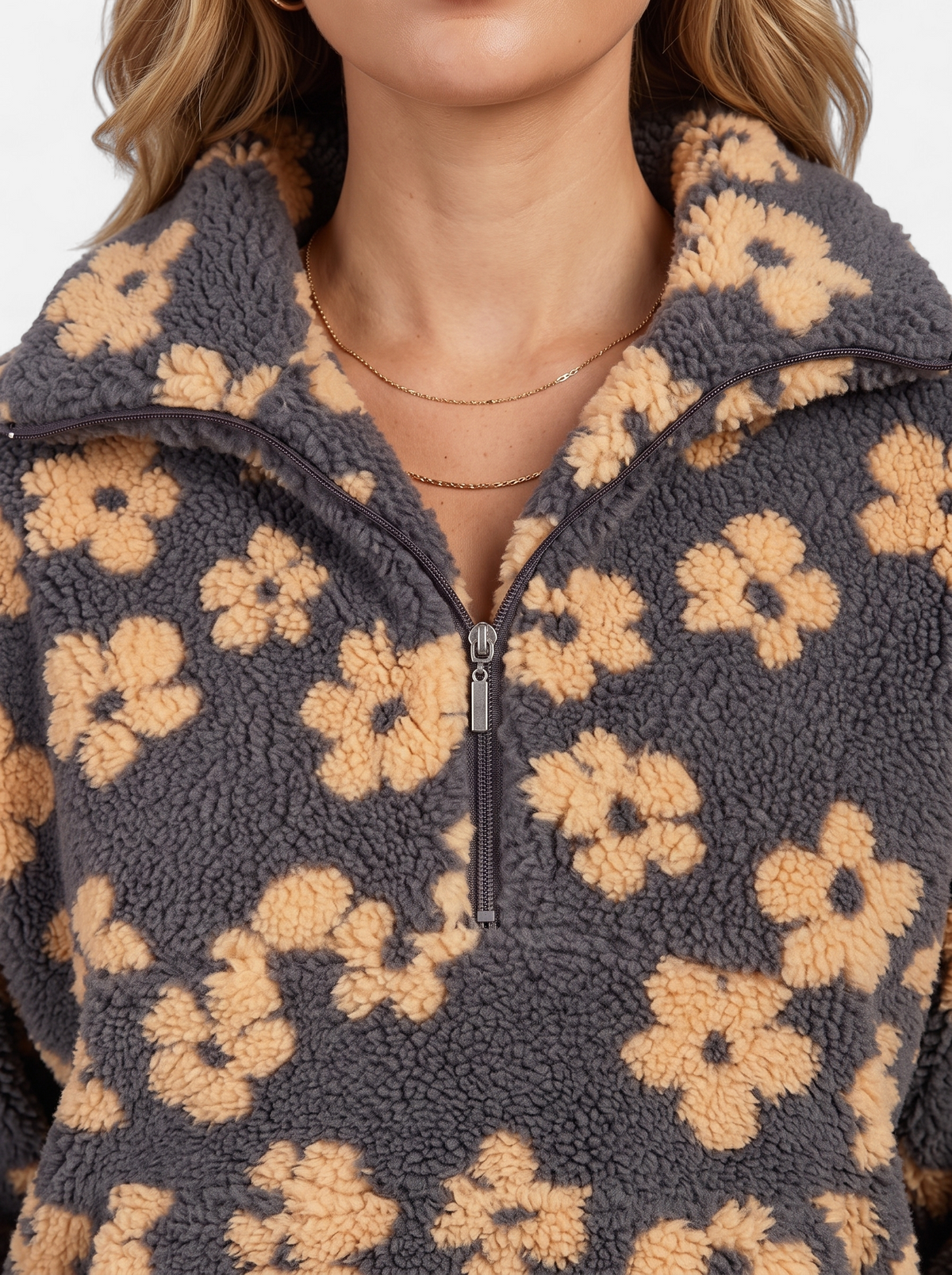 Women's yellow floral fleece half-zip jacket detail shot