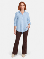 Women's blue oversized linen button-up shirt full body shot