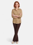 Women's brown oversized linen button-up shirt full body shot