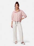 Women's pink polka dot bomber jacket full body shot