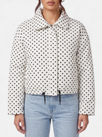 Women's white polka dot bomber jacket detail shot