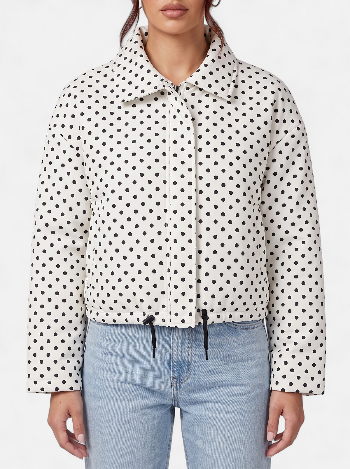 Women's white polka dot bomber jacket detail shot