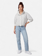 Women's white polka dot bomber jacket full body shot
